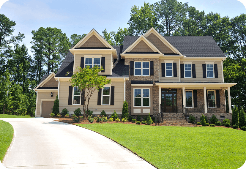 Beautiful two-story house with beige siding and landscaping